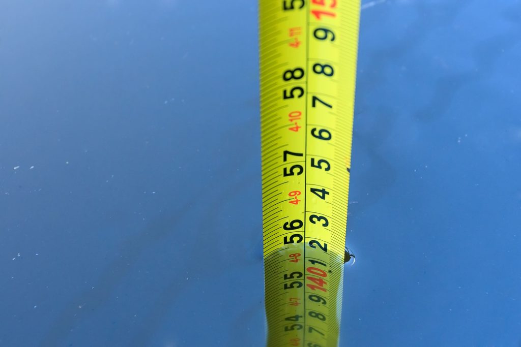 Measuring the inside of an overflow channel before ordering a swimming pool grating Singapore replacement